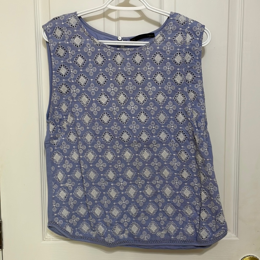 Baby blue sleeveless blouse